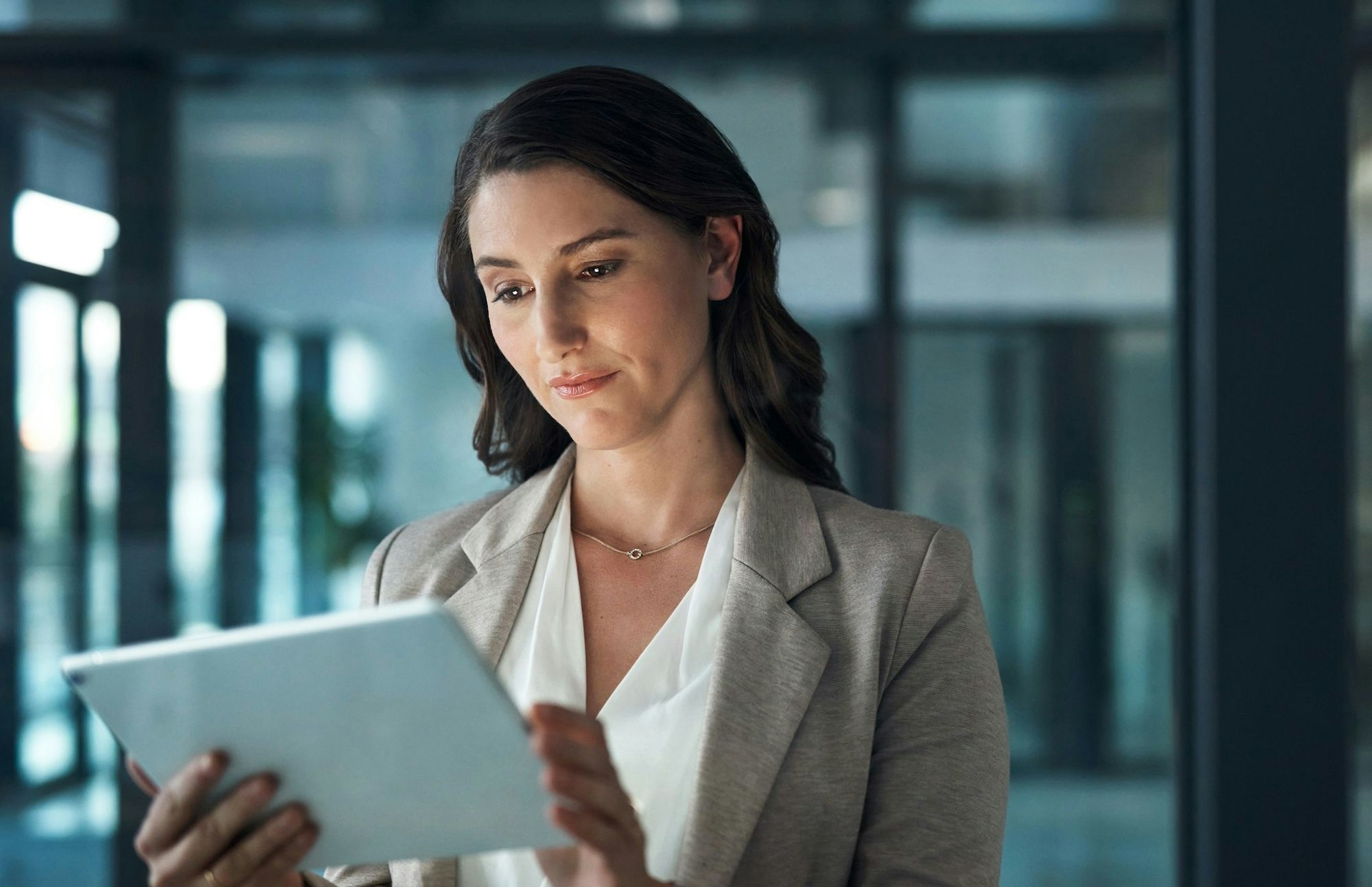 Cybersecurity professional looking at a tablet